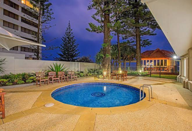 Surfers Aquarius On The Beach Image