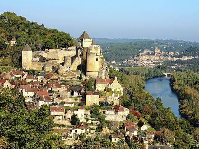 A romantic hamlet with lush gardens on a hill