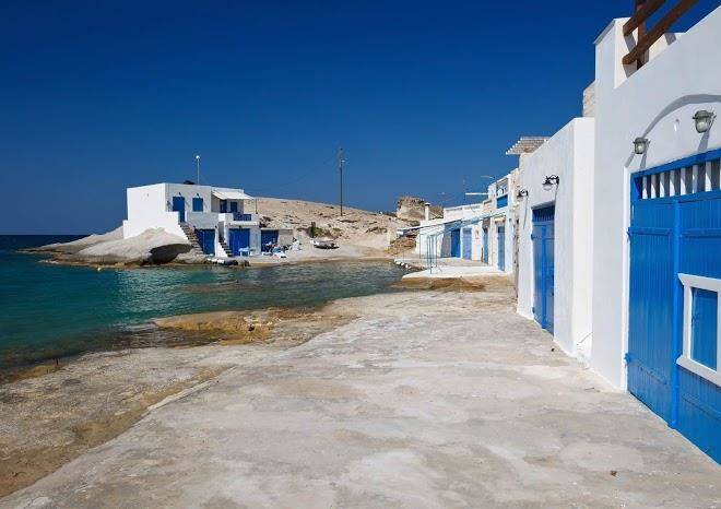 Manolis and filio home by the sea