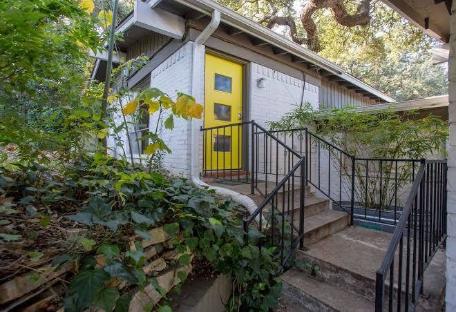 Soco spaces travis heights modern blue door